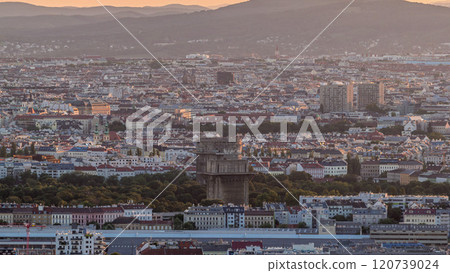 Aerial panoramic view of Vienna city with skyscrapers, historic buildings and a riverside promenade timelapse in Austria. Aerial panoramic view of Vienna city with skyscrapers, historic buildings and a riverside promenade timelapse in Austria. 120739024