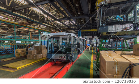 Conveyor assembly stage the body of tractor at big industrial factory timelapse 120739030