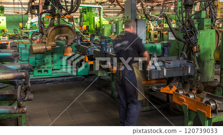 Conveyor assembly stage the body of tractor at big industrial factory timelapse Conveyor assembly stage the body of tractor at big industrial factory timelapse 120739033