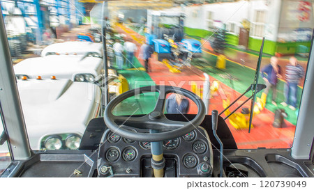 Conveyor assembly stage the body of tractor at big industrial factory timelapse Conveyor assembly stage the body of tractor at big industrial factory timelapse 120739049