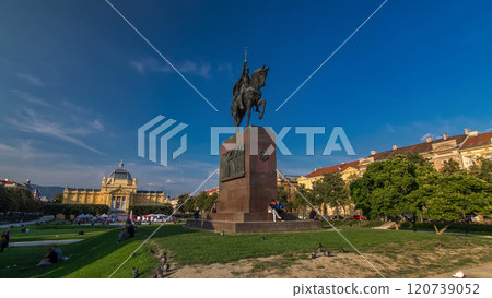 Monument of the Croatian King Tomislav timelapse hyperlapse and art pavilion in colorful park, in Zagreb, capital of Croatia 120739052
