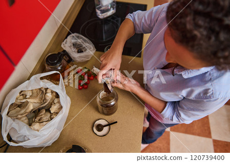 Person preparing fresh ingredients for cooking in kitchen Person preparing fresh ingredients for cooking in kitchen 120739400