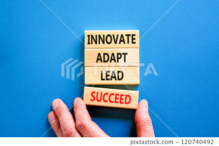 Innovate adapt lead succeed symbol. Concept words Innovate Adapt Lead Succeed on beautiful wooden blocks. Beautiful blue background. Business innovate adapt lead succeed concept. Copy space. 120740492