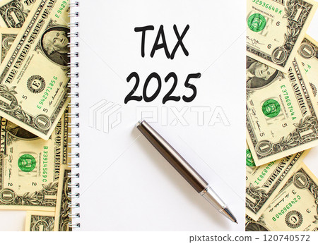 Planning tax 2025 new year symbol. Concept words Tax 2025 on beautiful white note. Beautiful background from dollar bills. Black pen. Business tax 2025 new year concept. Copy space. Planning tax 2025 new year symbol. Concept words Tax 2025 on beautiful white note. Beautiful background from dollar bills. Black pen. Business tax 2025 new year concept. Copy space. 120740572