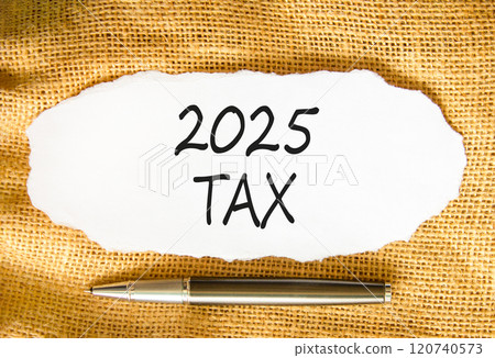 Planning 2025 tax new year symbol. Concept words 2025 Tax on beautiful white paper. Beautiful canvas background. Beautiful metallic pen. Business 2025 tax new year concept. Copy space. 120740573
