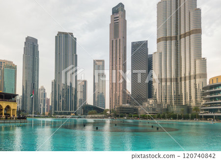 High-rise buildings in Downtown Dubai with a panoramic view of the fountain, symbolizing the city's modern architecture and luxury High-rise buildings in Downtown Dubai with a panoramic view of the fountain, symbolizing the city's modern architecture and luxury 120740842
