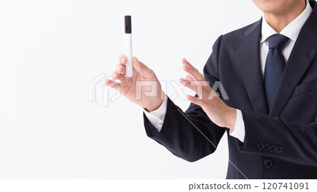 A person giving an explanation in front of a whiteboard (stock photo) 120741091
