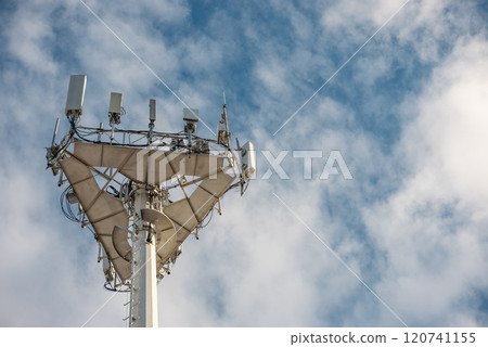 5g mobile network communication tower with cellular antenna transmitter and receiver, broadcasting 4g lte equipment, phone network station on sky with clouds background 5g mobile network communication tower with cellular antenna transmitter and receiver, broadcasting 4g lte equipment, phone network station on sky with clouds background 120741155