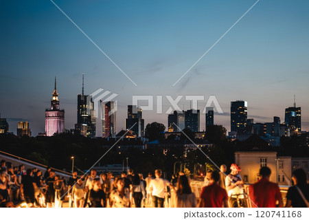 sunset over skyline of Warsaw city with skyscrapers and downtown district, crowd of people walking, tourist travel destination, rush hour in capital of Poland 4k, vertical video footage 120741168