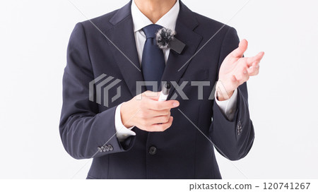 A person giving an explanation in front of a whiteboard (stock photo) 120741267