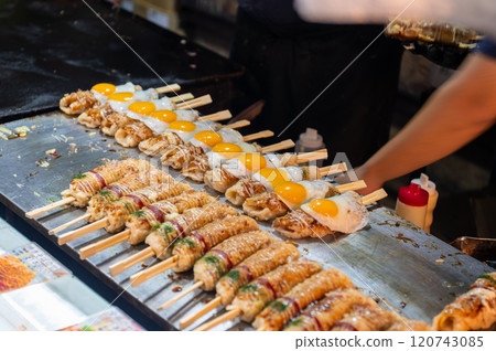 Hashimaki (hamburger wrapped in chopsticks) sold at a festival stall in Japan 120743085