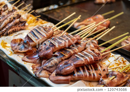 Grilled squid sold at a festival stall in Japan 120743086