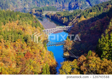 Tadami Line: A train crossing the Tadami River Bridge in autumn (Mishima Town, Fukushima Prefecture, mid-November morning) Tadami Line: A train crossing the Tadami River Bridge in autumn (Mishima Town, Fukushima Prefecture, mid-November morning) 120743588
