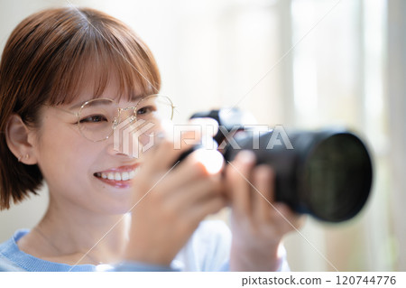 Camera girl taking a picture Camera girl taking a picture 120744776