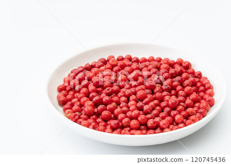 Pink pepper in a plate Pink pepper in a plate 120745436