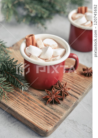 Two red enamel mugs with hot chocolate Two red enamel mugs with hot chocolate 120745692