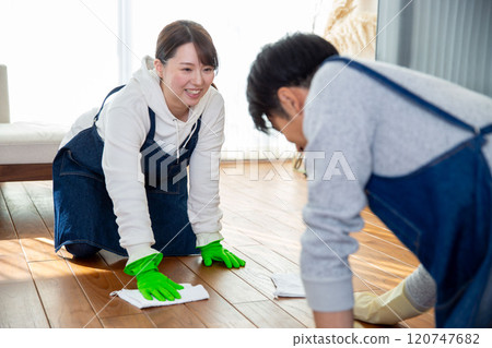 Spring cleaning: A young Japanese couple cleaning together Spring cleaning: A young Japanese couple cleaning together 120747682