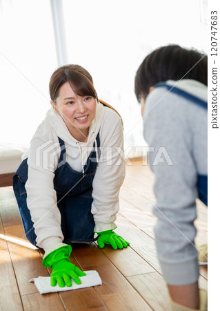 Spring cleaning: A young Japanese couple cleaning together Spring cleaning: A young Japanese couple cleaning together 120747683