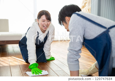 Spring cleaning: A young Japanese couple cleaning together Spring cleaning: A young Japanese couple cleaning together 120747684