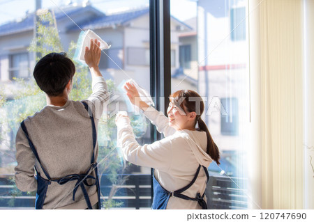 Back view of a Japanese couple cleaning windows 120747690