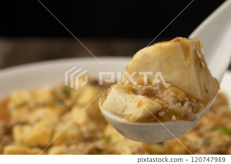 Mapo tofu: Lift up the steaming mapo tofu with a spoon Mapo tofu: Lift up the steaming mapo tofu with a spoon 120747989