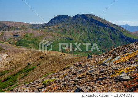 Climbing Mount Daisetsu Ohachidaira: Autumn foliage at Japan's 100 famous mountains, a spectacular view in Hokkaido 120748783