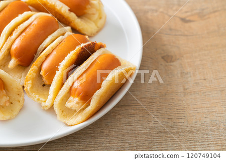 flat pancake roll with sausage flat pancake roll with sausage 120749104