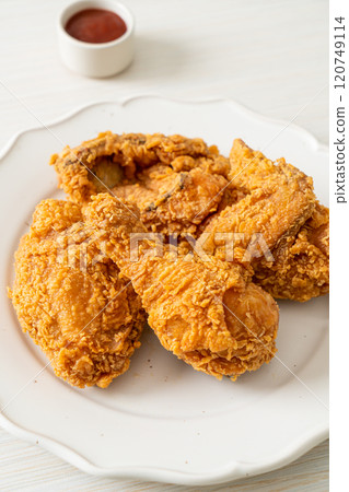 fried chicken with ketchup on plate fried chicken with ketchup on plate 120749114