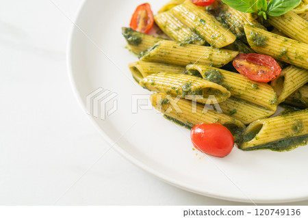 penne pasta with pesto sauce and tomatoes penne pasta with pesto sauce and tomatoes 120749136