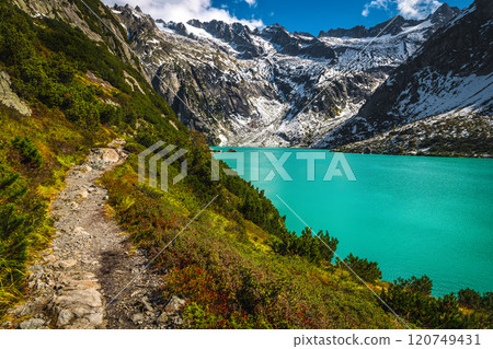 Hiking trail on the shore of the Gelmersee lake, Switzerland Hiking trail on the shore of the Gelmersee lake, Switzerland 120749431
