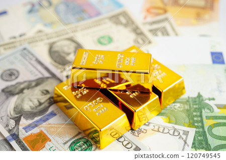 Gold bars with US dollar and Euro banknote money, finance trading investment business currency. 120749545
