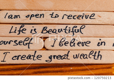 Positive thoughts for increasing selfesteem on wooden posts on wooden background 120750213