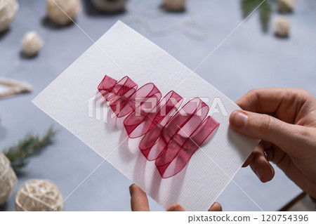 Christmas tree ribbon Sustainable Christmas preparation Diy process of making handmade greeting cards. Step by step activity for children. Inclusive and responsible stress relief holiday hobby 120754396