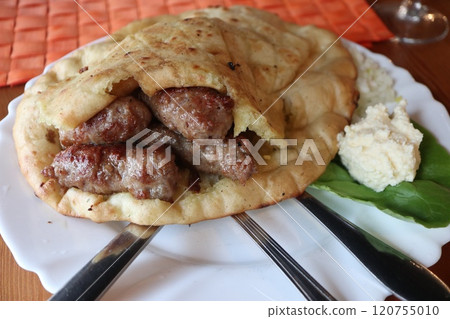Bosnian cuisine at Cevapi restaurant in Mostar Bosnian cuisine at Cevapi restaurant in Mostar 120755010