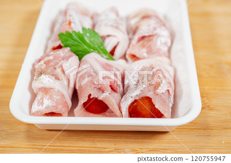 Persimmon wrapped in pork loin Persimmon wrapped in pork loin 120755947