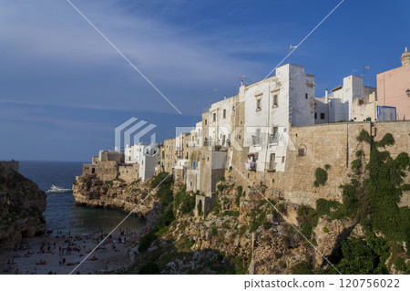 Traditional houses on dramatic cliffs rising from Adriatic sea in Polignano a Mare, Italy Traditional houses on dramatic cliffs rising from Adriatic sea in Polignano a Mare, Italy 120756022
