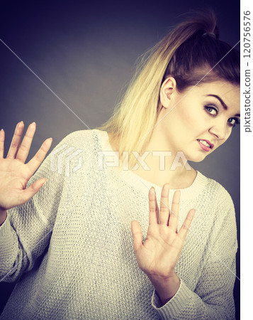 Woman deny something showing stop gesture with hands 120756576
