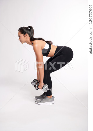 an asian woman is working out with dumbbells wearing the sport exercise suit with white background, an asian woman is working out with dumbbells wearing the sport exercise suit with white background, 120757605