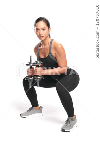 an asian woman is working out with dumbbells wearing the sport exercise suit with white background, 120757610