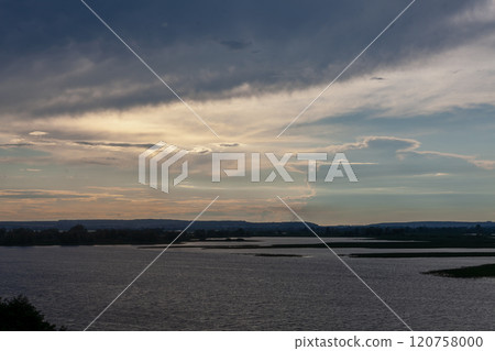 Serenity at Vilga River during twilight with clouds reflecting the days end 120758000