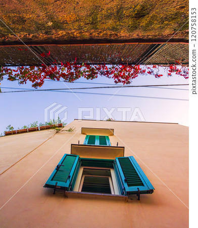 The enchanting and captivating architectural details are beautifully set against a lovely blue sky in a Capri island The enchanting and captivating architectural details are beautifully set against a lovely blue sky in a Capri island 120758153