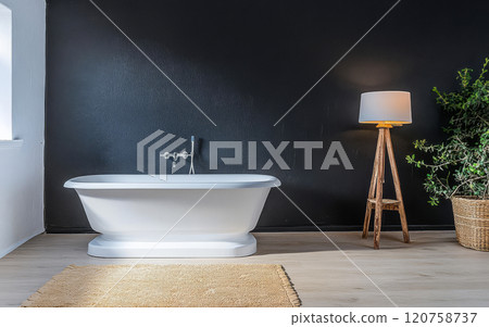 Elegant bathroom setting with modern bathtub and stylish lamp in bright interior 120758737
