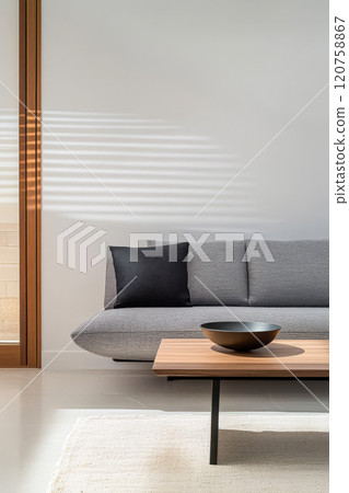 Comfortable modern living room with minimalist design and natural lighting in a contemporary apartment 120758867