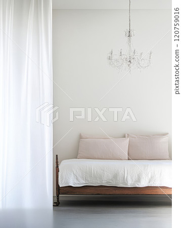 Elegant minimalist bedroom featuring a vintage daybed and soft white curtains 120759016