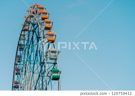 Colorful ferris wheel with blue sky Colorful ferris wheel with blue sky 120759412