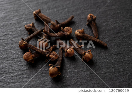 Whole cloves spice over black background. 120760039
