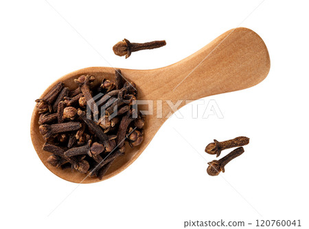 Whole clove buds in a wooden spoon cutout macro. Whole clove buds in a wooden spoon cutout macro. 120760041