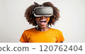 Teenager black girl experiencing virtual reality with joyful expression 120762404