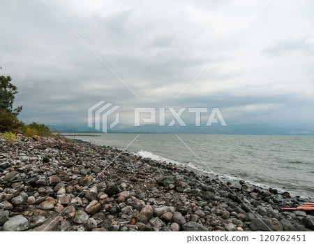 Rocky shore of the sea or lake.The sea of Galilee also called Lake Tiberias or Kinneret, Israel. Rocky shore of the sea or lake.The sea of Galilee also called Lake Tiberias or Kinneret, Israel. 120762451