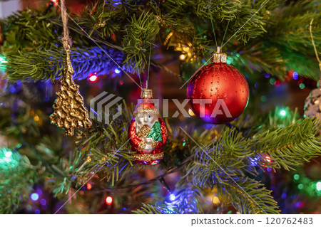 Christmas tree decorated with balls and gerland. 120762483